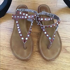 Express brown ankle wrap sandal with stud detail.